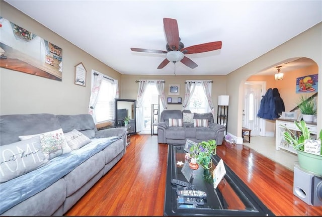 28 Trinity Pl, Staten Island, NY 10310 - living area with arched walkways, plenty of natural light, wood finished floors, and a ceiling fan