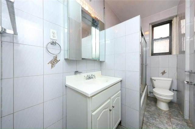1543 W 1st St Unit D1, Brooklyn, NY 11204 - full bath with tile walls, vanity, toilet, and bath / shower combo with glass door