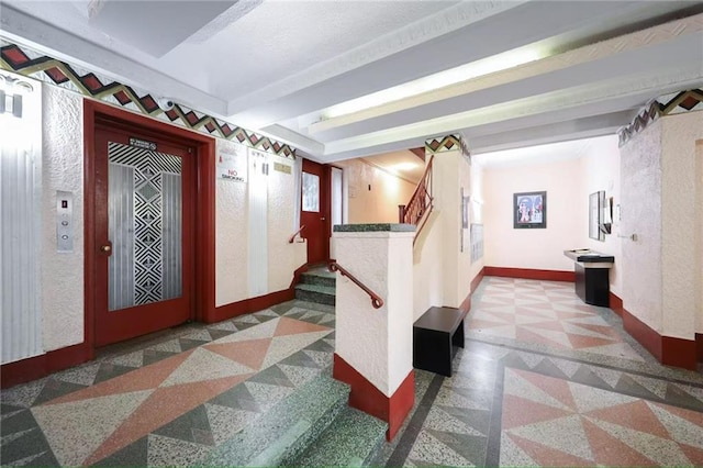 1543 W 1st St Unit D1, Brooklyn, NY 11204 - entrance foyer with inlaid floor details, baseboards, and stairway