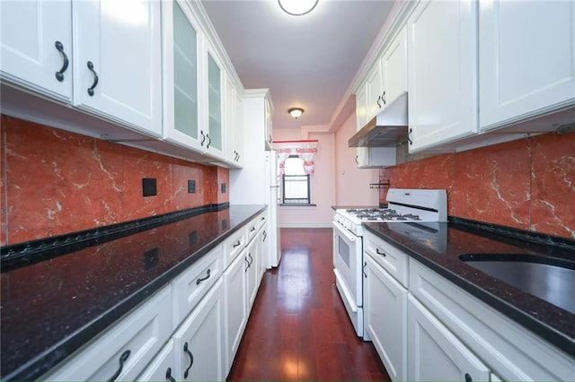 1543 W 1st St Unit D1, Brooklyn, NY 11204 - kitchen with white range with gas stovetop, under cabinet range hood, white cabinets, dark wood-style flooring, and tasteful backsplash