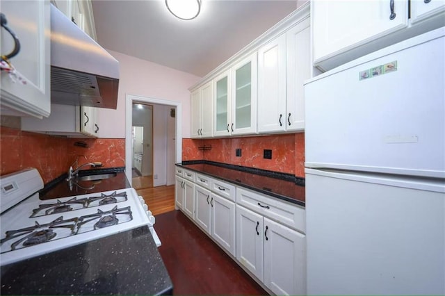 1543 W 1st St Unit D1, Brooklyn, NY 11204 - kitchen with white appliances, exhaust hood, white cabinets, and glass insert cabinets