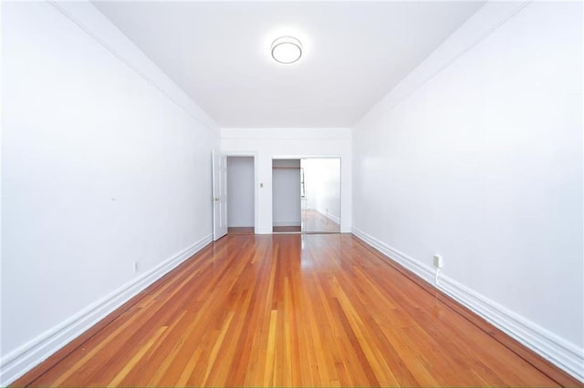 1543 W 1st St Unit D1, Brooklyn, NY 11204 - unfurnished bedroom with light wood-style flooring, baseboards, and a closet