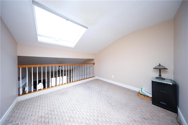 177 Russek Dr Unit 1, Staten Island, NY 10312 - bonus room featuring a skylight, lofted ceiling, baseboards, and carpet