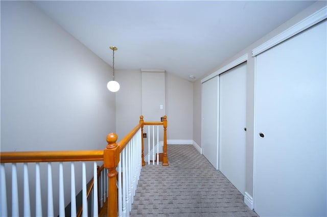177 Russek Dr Unit 1, Staten Island, NY 10312 - hall featuring an upstairs landing, carpet floors, vaulted ceiling, and baseboards