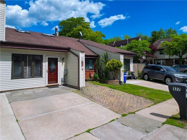 177 Russek Dr Unit 1, Staten Island, NY 10312 - ranch-style home featuring a shingled roof and a chimney