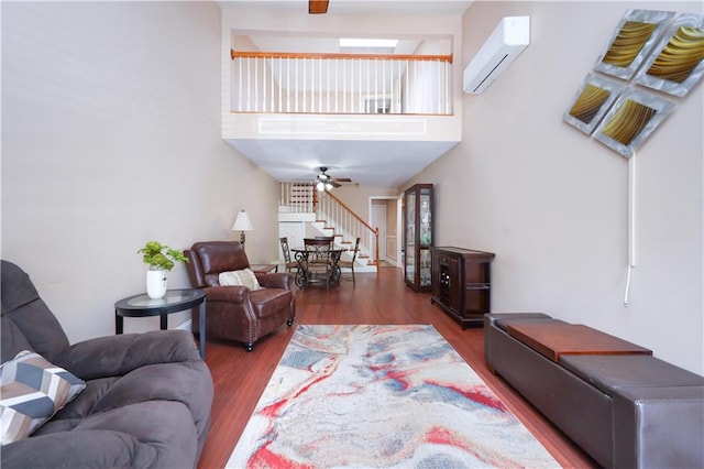 177 Russek Dr Unit 1, Staten Island, NY 10312 - living area with a wall mounted AC, wood finished floors, a high ceiling, and stairway