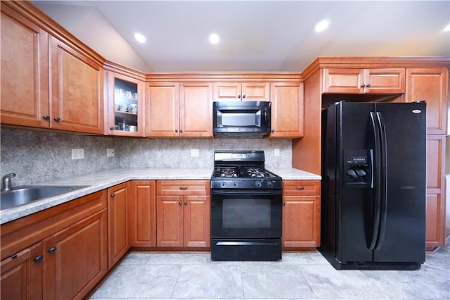 177 Russek Dr Unit 1, Staten Island, NY 10312 - kitchen with black appliances, backsplash, light countertops, vaulted ceiling, and glass insert cabinets