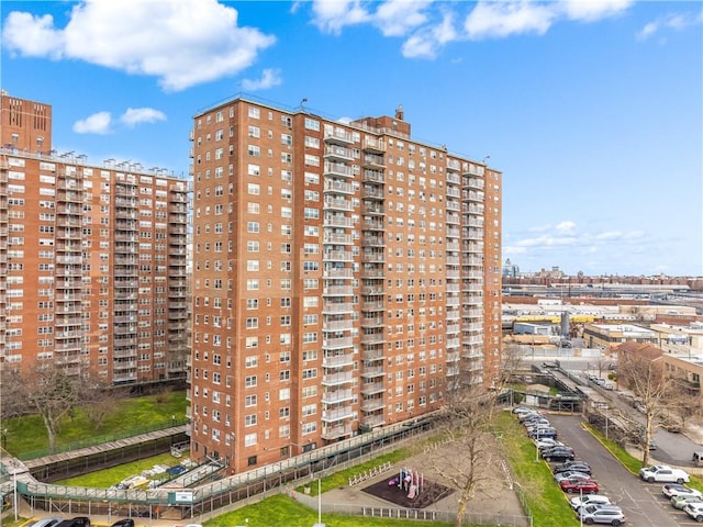 2475 W 16th St Unit 9H, Brooklyn, NY 11214 - view of apartment building / complex with uncovered parking and a view of city
