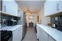 1711 Bay Ridge Parkway, Brooklyn, NY 11204 - kitchen featuring light countertops and backsplash
