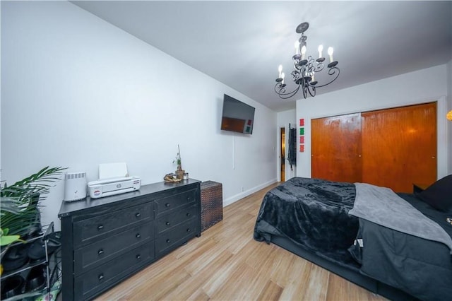 1711 Bay Ridge Parkway, Brooklyn, NY 11204 - bedroom with a chandelier, light wood-style flooring, a closet, and baseboards