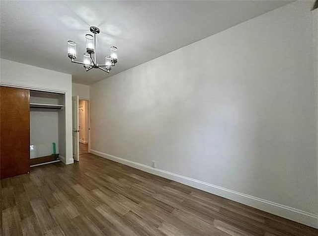 1711 Bay Ridge Parkway, Brooklyn, NY 11204 - unfurnished bedroom featuring a chandelier, wood finished floors, a closet, and baseboards