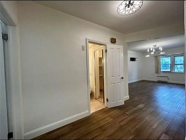 1711 Bay Ridge Parkway, Brooklyn, NY 11204 - unfurnished room with radiator heating unit, a chandelier, dark wood-style floors, and baseboards