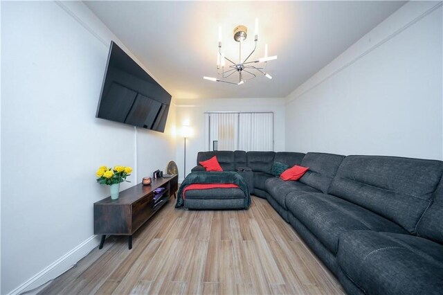 1711 Bay Ridge Parkway, Brooklyn, NY 11204 - living area featuring a chandelier, light wood-type flooring, and baseboards