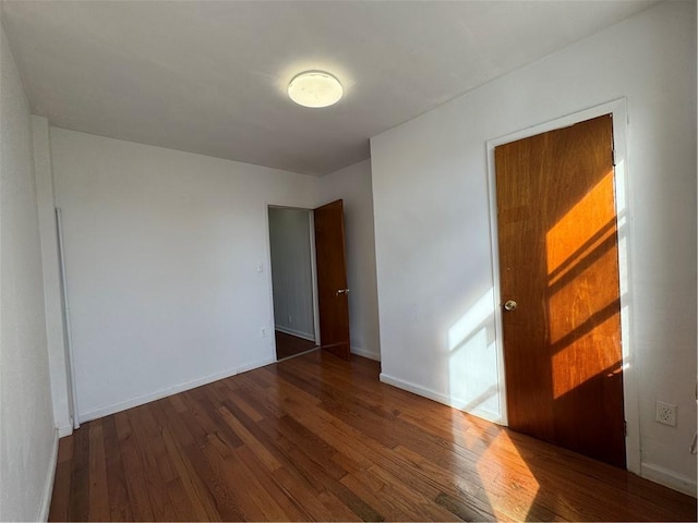 1414 76th St, Brooklyn, NY 11228 - empty room featuring wood finished floors and baseboards
