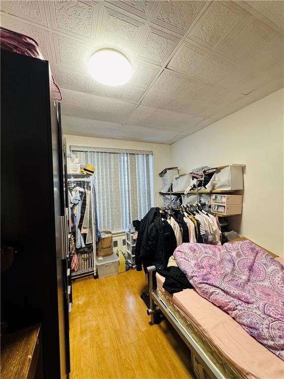 1414 76th St, Brooklyn, NY 11228 - bedroom with wood finished floors and an ornate ceiling