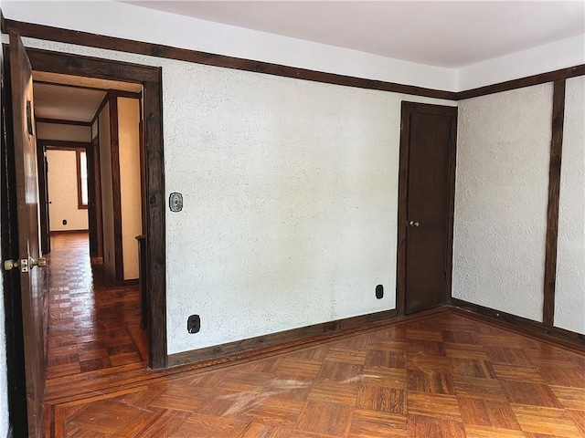 974 77th St, Brooklyn, NY 11228 - spare room with a textured wall and baseboards