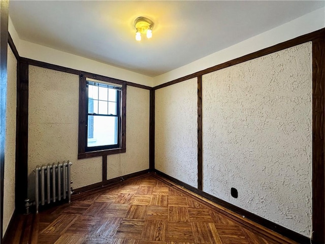 974 77th St, Brooklyn, NY 11228 - spare room featuring radiator heating unit and baseboards
