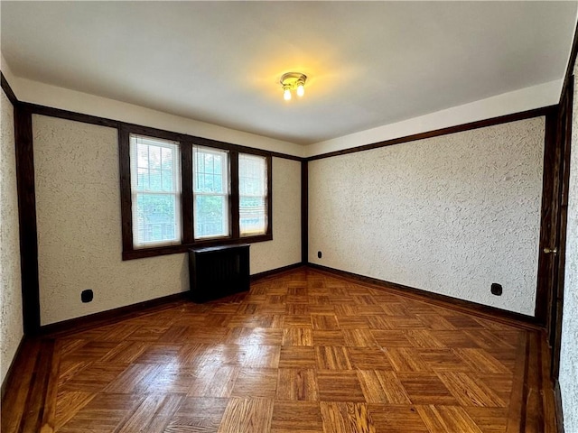 974 77th St, Brooklyn, NY 11228 - unfurnished room with baseboards and a textured wall
