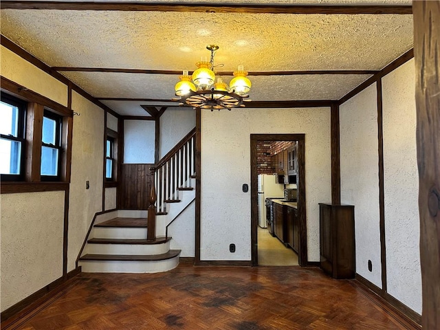 974 77th St, Brooklyn, NY 11228 - stairs with a textured wall, a chandelier, a textured ceiling, and baseboards