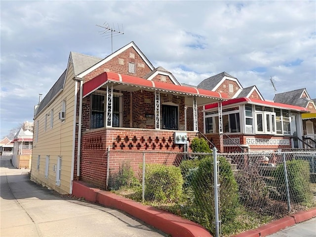 2315 E 17th St, Brooklyn, NY 11229 - view of front facade featuring brick siding and covered porch