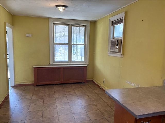 2315 E 17th St, Brooklyn, NY 11229 - unfurnished dining area featuring baseboards and cooling unit
