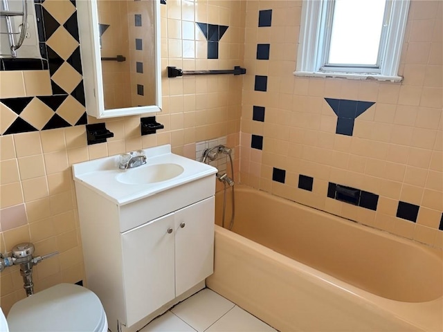 2315 E 17th St, Brooklyn, NY 11229 - bathroom featuring tile walls, vanity, toilet,  shower combination, and tile patterned floors