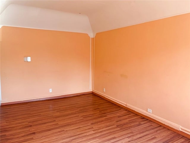 2315 E 17th St, Brooklyn, NY 11229 - empty room with lofted ceiling, wood finished floors, and baseboards