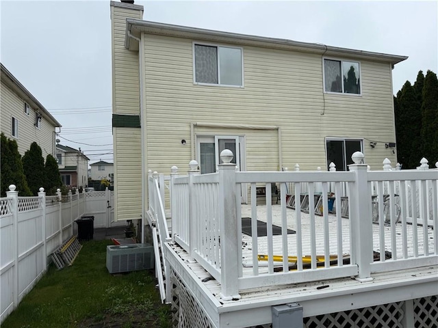 7 Georgetown Ln, Brooklyn, NY 11234 - rear view of property featuring a deck, central AC unit, and a chimney