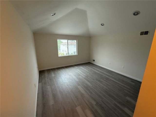 7 Georgetown Ln, Brooklyn, NY 11234 - unfurnished room featuring dark wood-style flooring, vaulted ceiling, baseboards, and recessed lighting