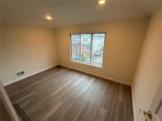 7 Georgetown Ln, Brooklyn, NY 11234 - empty room featuring dark wood-style flooring, baseboards, and recessed lighting