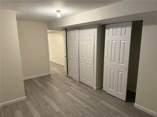 7 Georgetown Ln, Brooklyn, NY 11234 - unfurnished bedroom with wood finished floors, baseboards, and a closet