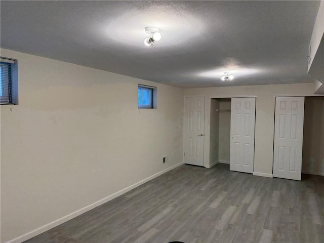 7 Georgetown Ln, Brooklyn, NY 11234 - finished below grade area with wood finished floors, baseboards, and a textured ceiling