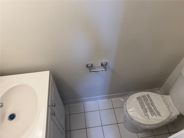 7 Georgetown Ln, Brooklyn, NY 11234 - half bathroom with toilet, vanity, and tile patterned flooring