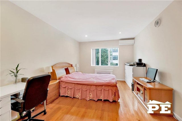 2077 Hendrickson St, Brooklyn, NY 11234 - bedroom featuring a wall unit AC, an office area, light wood finished floors, baseboards, and recessed lighting