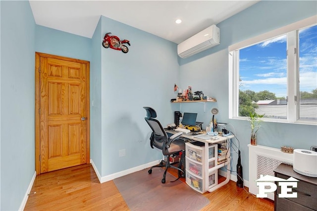 2077 Hendrickson St, Brooklyn, NY 11234 - home office featuring a wall mounted air conditioner, wood finished floors, baseboards, and recessed lighting