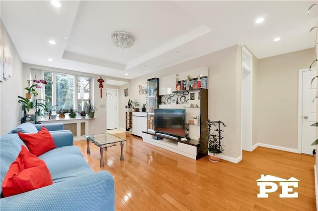 2077 Hendrickson St, Brooklyn, NY 11234 - living room featuring wood finished floors, a raised ceiling, baseboards, and recessed lighting
