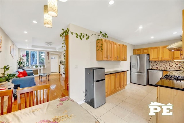 2077 Hendrickson St, Brooklyn, NY 11234 - kitchen featuring appliances with stainless steel finishes, recessed lighting, backsplash, light tile patterned floors, and dark countertops