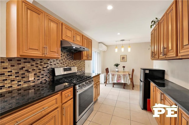 2077 Hendrickson St, Brooklyn, NY 11234 - kitchen featuring stainless steel appliances, under cabinet range hood, a wall mounted AC, tasteful backsplash, and light tile patterned floors