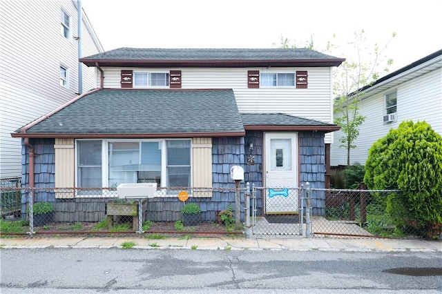 24 Keen Ct, Brooklyn, NY 11229 - view of front of property with a fenced front yard, a gate, and a shingled roof