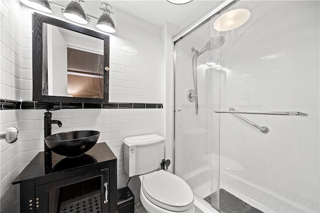 680 81st St Unit 1B, Brooklyn, NY 11228 - bathroom with a stall shower, toilet, vanity, and tile walls