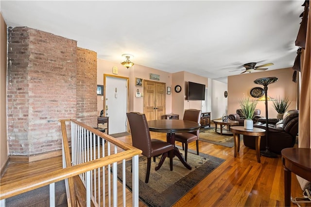 680 81st St Unit 1B, Brooklyn, NY 11228 - dining room featuring wood finished floors, a ceiling fan, and baseboards