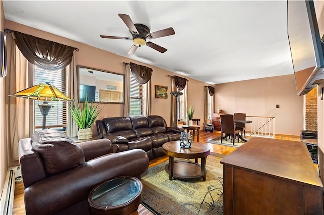 680 81st St Unit 1B, Brooklyn, NY 11228 - living area featuring a baseboard heating unit, light wood finished floors, and a ceiling fan