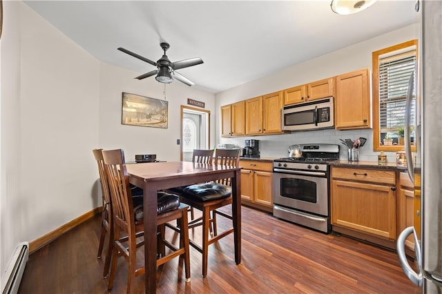 680 81st St Unit 1B, Brooklyn, NY 11228 - kitchen featuring appliances with stainless steel finishes, a baseboard radiator, dark wood-style flooring, a ceiling fan, and backsplash