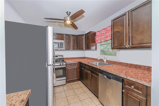47 Center Pl, Staten Island, NY 10306 - kitchen with appliances with stainless steel finishes, a sink, a ceiling fan, light tile patterned floors, and dark brown cabinetry