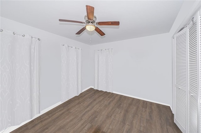 47 Center Pl, Staten Island, NY 10306 - unfurnished bedroom with wood finished floors, ceiling fan, baseboards, and a closet