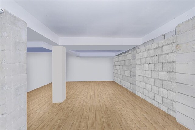 47 Center Pl, Staten Island, NY 10306 - below grade area with concrete block wall and wood finished floors