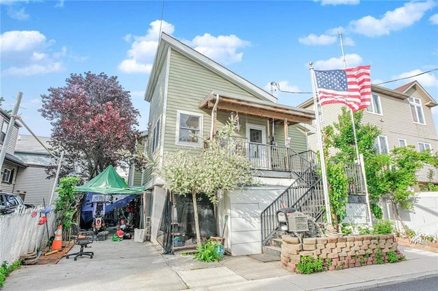 47 Center Pl, Staten Island, NY 10306 - view of front of home featuring covered porch and stairway