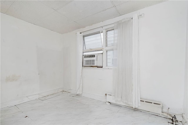 2424 W 3rd St, Brooklyn, NY 11223 - unfurnished room featuring a drop ceiling, cooling unit, and light marble finish floors