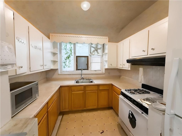 1685 E 2nd St, Brooklyn, NY 11223 - kitchen featuring under cabinet range hood, stainless steel microwave, white gas range, a sink, and open shelves