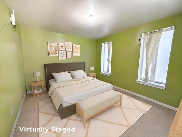 1685 E 2nd St, Brooklyn, NY 11223 - bedroom with baseboards and tile patterned floors